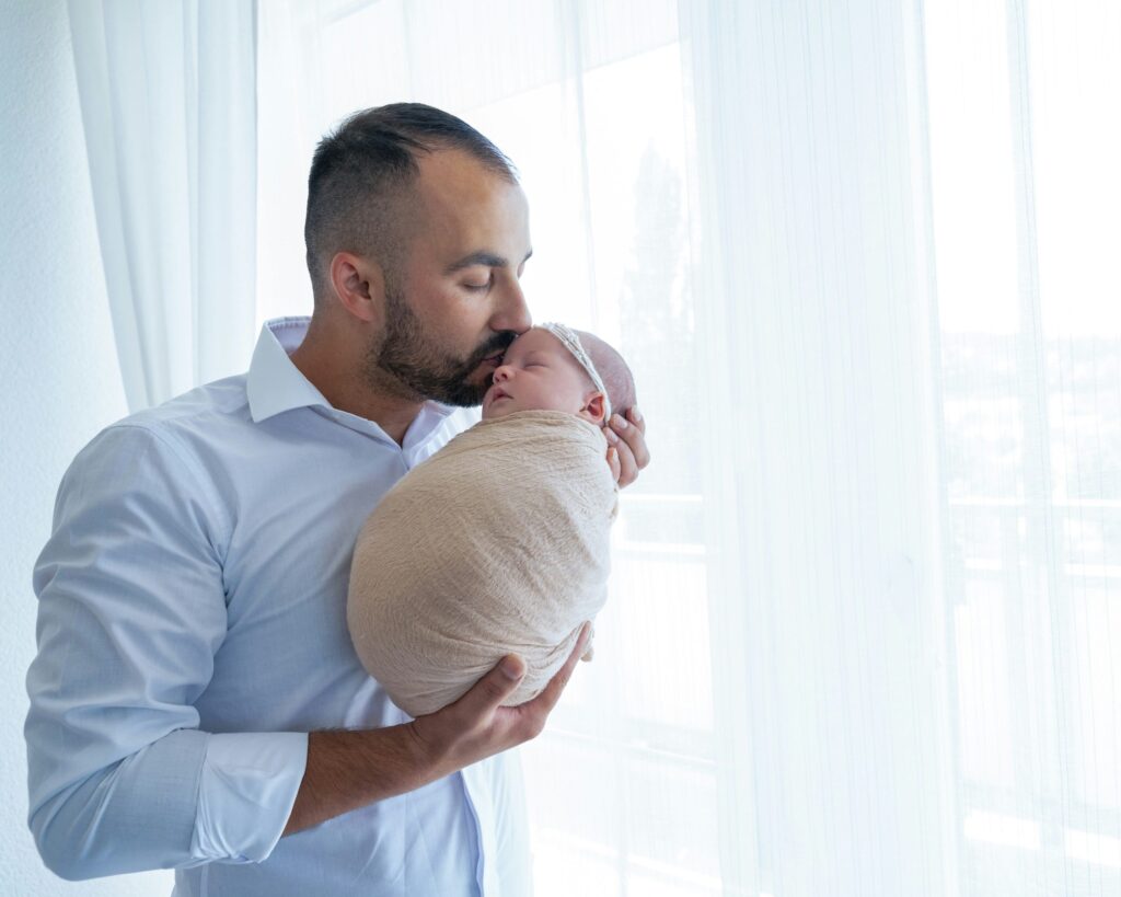 man holding baby